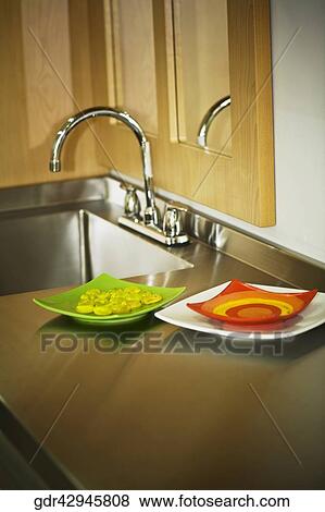 Close-up of a kitchen sink with trays View Large Photo Image Stock Photo - Close-up of a kitchen sink with trays. Fotosearch