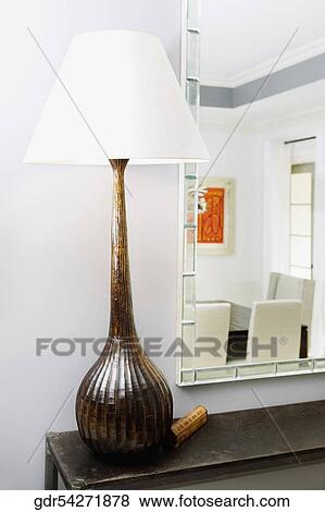 Close-up of a lamp on a table View Large Photo Image Stock Photo - Close-up of a lamp on a table. Fotosearch