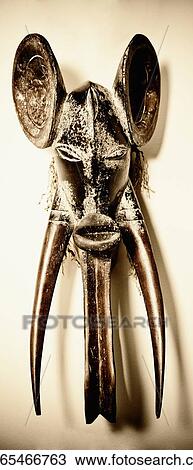 Close-up of a mask mounted on a wall View Large Photo Image Stock Image - Close-up of a mask mounted on a wall. Fotosearch