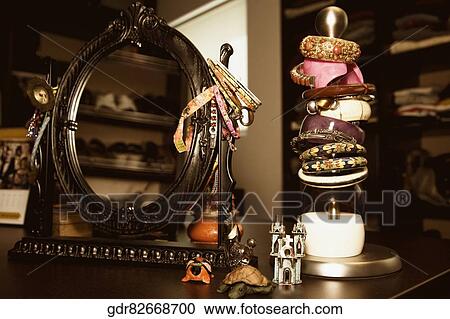 Close-up of a mirror with bracelet stand View Large Photo Image Stock Image - Close-up of a mirror with bracelet stand. Fotosearch