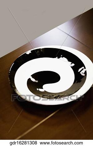 Close-up of a plate on a table View Large Photo Image Stock Photo - Close-up of a plate on a table. Fotosearch