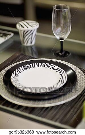 Stock Photo - Close-up of a plate with a wine glass. Fotosearch