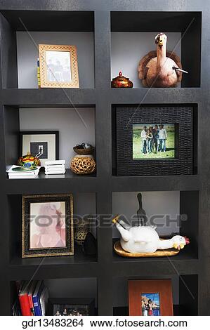 Close-up of a shelf with antiques View Large Photo Image Picture - Close-up of a shelf with antiques. Fotosearch