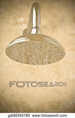 Picture - Close-up of a shower head with dripping water. Fotosearch