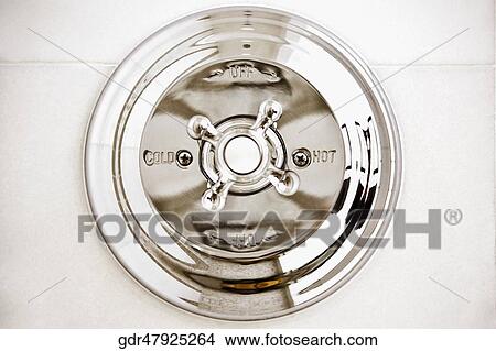 Picture - Close-up of a shower knob. Fotosearch