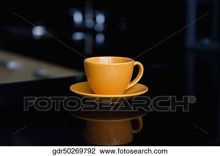 Close-up of a tea cup with a saucer View Large Photo Image Stock Image - Close-up of a tea cup with a saucer. Fotosearch