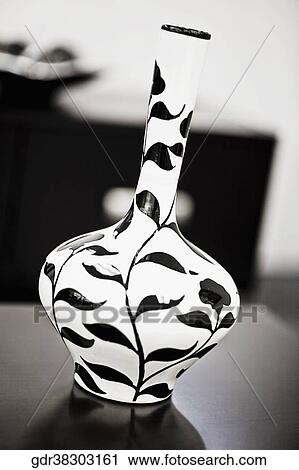 Close-up of a vase on a table View Large Photo Image Stock Image - Close-up of a vase on a table. Fotosearch