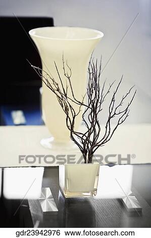 Close-up of a vase on a table View Large Photo Image Stock Photograph - Close-up of a vase on a table. Fotosearch