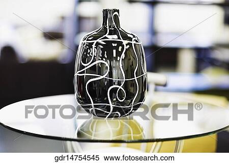 Close-up of a vase on a table View Large Photo Image Stock Photography - Close-up of a vase on a table. Fotosearch