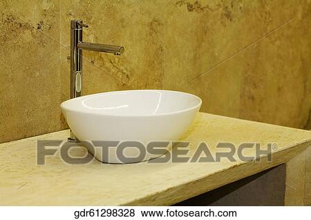 Stock Photo - Close-up of a wash bowl in the bathroom. Fotosearch
