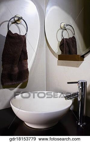 Stock Photo - Close-up of a wash bowl with a faucet. Fotosearch