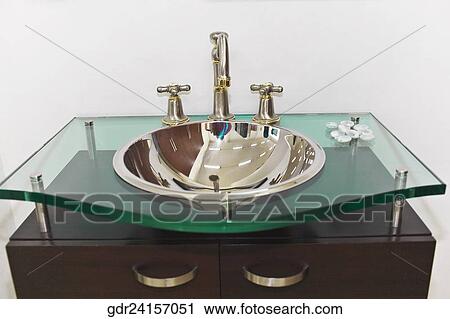 Stock Image - Close-up of a washbasin in the bathroom. Fotosearch