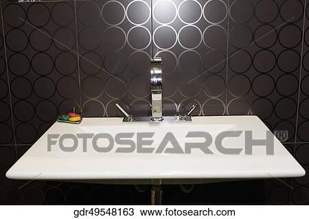 Close-up of a washbasin in the bathroom View Large Photo Image Stock Image - Close-up of a washbasin in the bathroom. Fotosearch