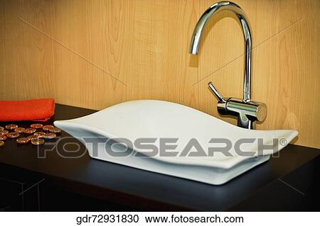 Stock Image - Close-up of a washbasin in the bathroom. Fotosearch