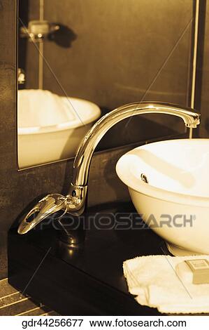 Close-up of a washbasin in the bathroom View Large Photo Image Stock Photo - Close-up of a washbasin in the bathroom. Fotosearch