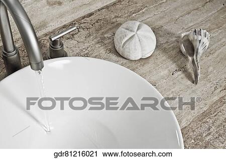 Close-up of a washbasin with shells View Large Photo Image Stock Image - Close-up of a washbasin with shells. Fotosearch