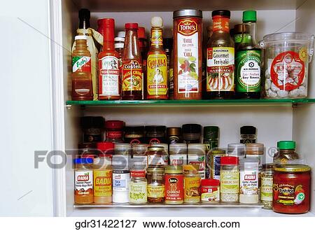 Close-up of assorted bottles on a shelf View Large Photo Image Stock Photo - Close-up of assorted bottles on a shelf. Fotosearch