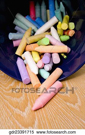 Stock Photography - Close-up of crayons spilling out from a container. Fotosearch