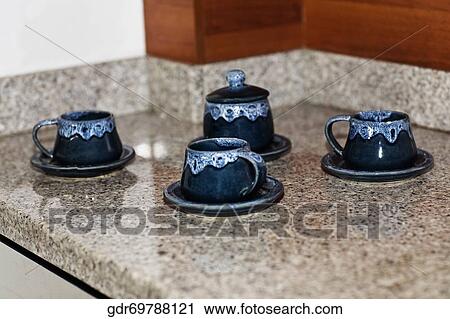 Close-up of cups with saucers View Large Photo Image Stock Image - Close-up of cups with saucers. Fotosearch