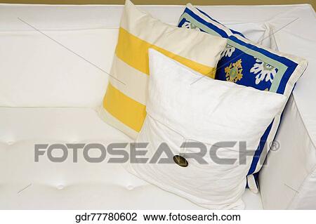 Stock Image - Close-up of cushions on a couch. Fotosearch