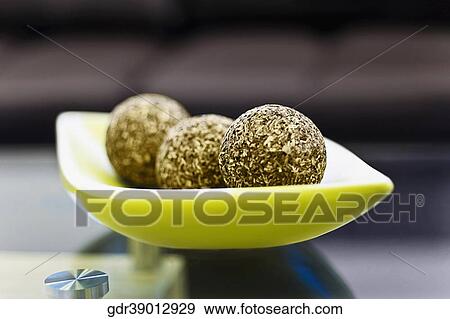 Close-up of decorative balls on a tray View Large Photo Image Stock Photo - Close-up of decorative balls on a tray. Fotosearch