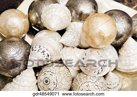 Close-up of decorative balls with shells View Large Photo Image Stock Image - Close-up of decorative balls with shells. Fotosearch