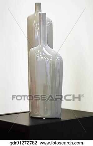 Close-up of decorative urns on a table View Large Photo Image Stock Image - Close-up of decorative urns on a table. Fotosearch