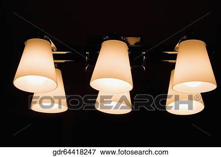 Stock Photo - Close-up of electric lights lit up. Fotosearch