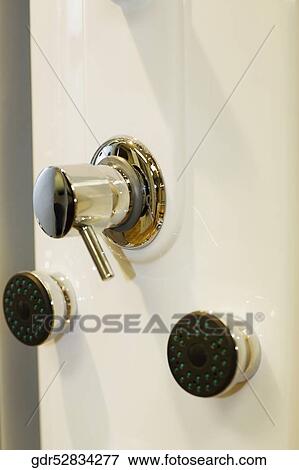 Close-up of faucets in the bathroom View Large Photo Image Stock Photo - Close-up of faucets in the bathroom. Fotosearch