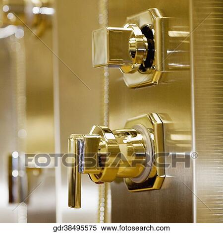Close-up of faucets in the bathroom View Large Photo Image Stock Photography - Close-up of faucets in the bathroom. Fotosearch