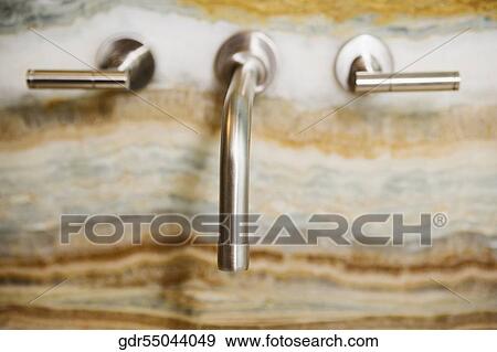Stock Photo - Close-up of faucets. Fotosearch