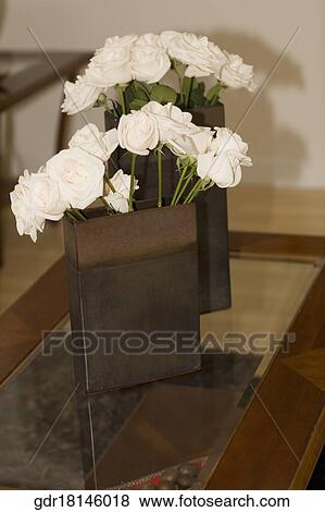 Close-up of flower vases on a table View Large Photo Image Stock Photo - Close-up of flower vases on a table. Fotosearch