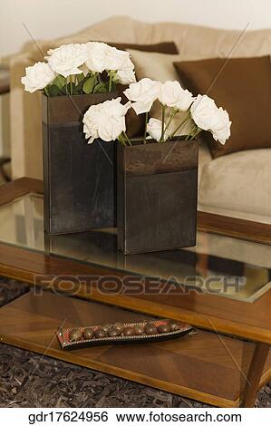 Close-up of flower vases on a table View Large Photo Image Stock Photograph - Close-up of flower vases on a table. Fotosearch