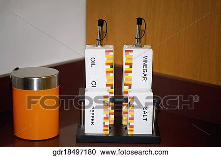 Close-up of salt shaker and pepper shaker with bottles View Large Photo Image Stock Image - Close-up of salt shaker and pepper shaker with bottles. Fotosearch