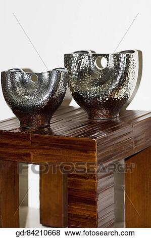 Close-up of showpieces on a stool View Large Photo Image Stock Photo - Close-up of showpieces on a stool. Fotosearch