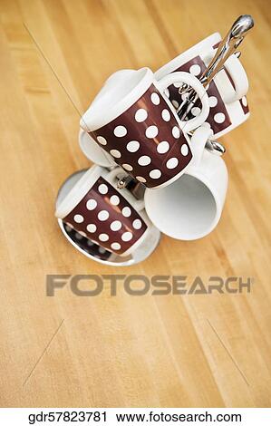 Close-up of tea cups on a tea cup stand View Large Photo Image Stock Image - Close-up of tea cups on a tea cup stand. Fotosearch