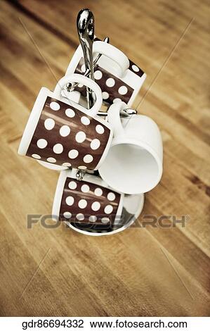 Close-up of tea cups on a tea cup stand View Large Photo Image Stock Image - Close-up of tea cups on a tea cup stand. Fotosearch