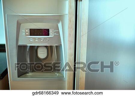 Close-up of the water dispenser of a refrigerator View Large Photo Image Stock Photo - Close-up of the water dispenser of a refrigerator. Fotosearch