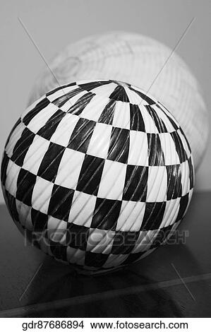 Picture - Close-up of two balls on a table. Fotosearch