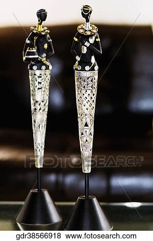 Stock Photo - Close-up of two figurines on a table. Fotosearch