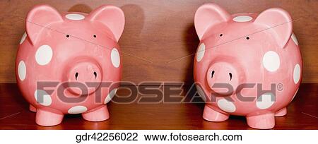 Close-up of two piggy banks View Large Photo Image Stock Image - Close-up of two piggy banks. Fotosearch