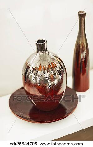 Close-up of vases with a plate View Large Photo Image Stock Photography - Close-up of vases with a plate. Fotosearch