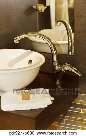 Stock Image - Close-up of washbasin in the bathroom. Fotosearch
