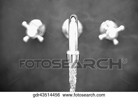 Close-up of water running from a faucet in the bathroom View Large Photo Image Stock Photograph - Close-up of water running from a faucet in the bathroom. Fotosearch