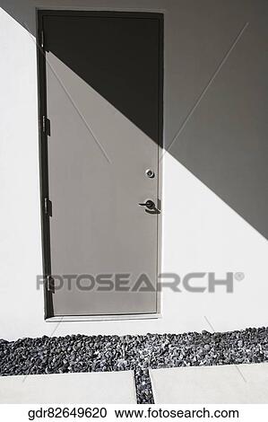 Stock Image - Closed door of a house. Fotosearch