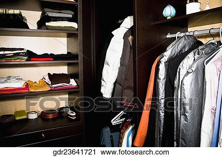 Clothes in almirah and shelves View Large Photo Image Stock Image - Clothes in almirah and shelves. Fotosearch