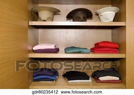 Clothes on shelves View Large Photo Image Stock Image - Clothes on shelves. Fotosearch