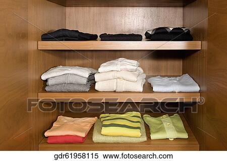 Clothes on shelves View Large Photo Image Stock Photography - Clothes on shelves. Fotosearch