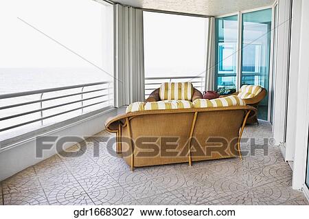 Couch in a balcony View Large Photo Image Stock Photo - Couch in a balcony. Fotosearch