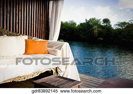 Couch in a poolside cabana View Large Photo Image Stock Photography - Couch in a poolside cabana. Fotosearch